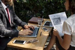 man and woman and man on laptop 