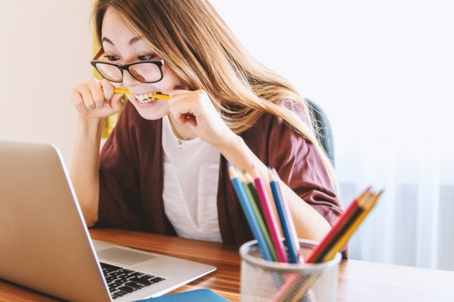 woman using laptop and stressed